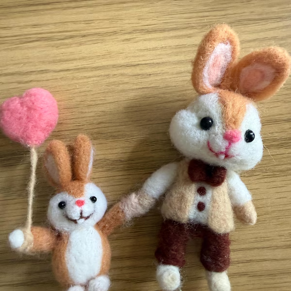 A custom handmade wool rabbit pair made for a customer
